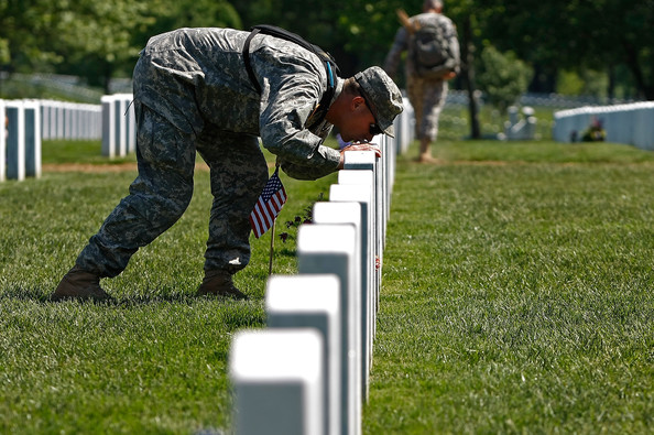 Memorial Day :: Solider kisses gravestone at Arlington. :: AnExtraordinaryDay.net
