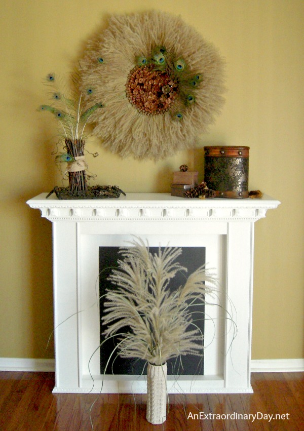 Do you have pampas grass growing in your yard?  Have you wanted to do something special with it for your home decor?  Put your DIY hat on and make your own Pampas Grass Wreath embellished with a Pine Cone center.  Without the peacock feathers, it almost looks like a huge sunflower.  This wreath will make a stunning statement for your fall home decor.