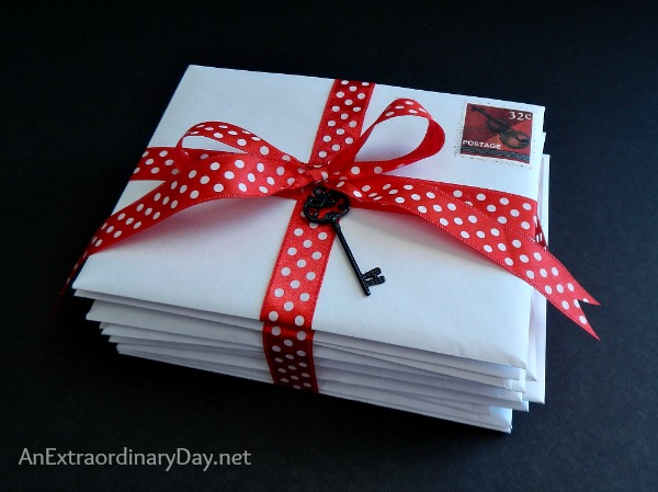 White Letters Tied up with Red Ribbon :: A Box Disguised as a Stack of Letters :: AnExtraordinaryDay.net