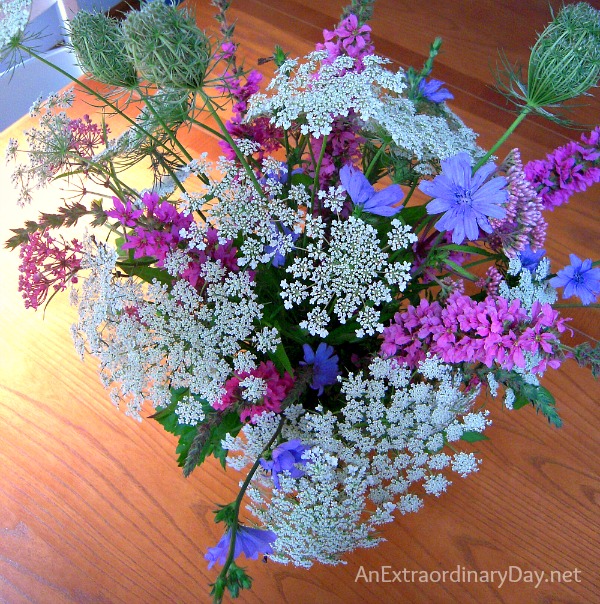 Summer wild flower bouquet including hydrangea, lilies, stock queen anne's  lace, and english ivy.