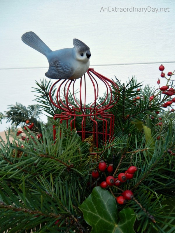 Ceramic bird and red rose hips are the finishing touch. AnExtraordinaryDay.net