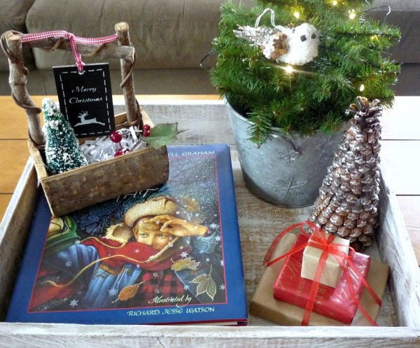 Create Christmas memories with vignettes like this sweet coffee table vignette tray.