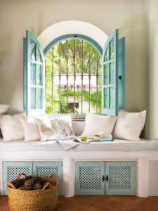 stunning window over a built-in seat in lovely aqua accent colors