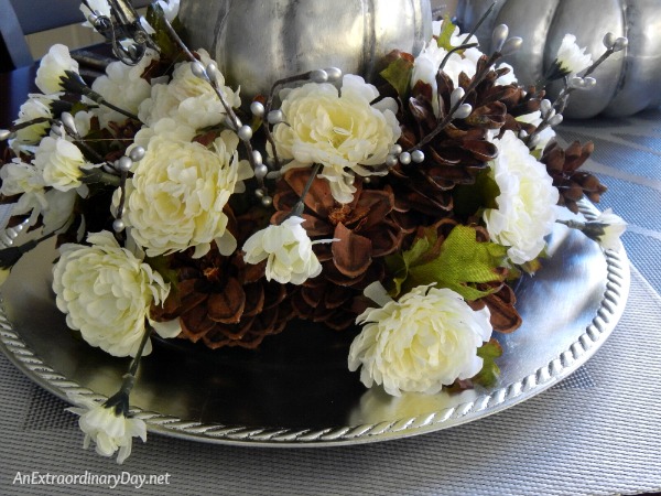 Mums and Pine Cones Surrounds a Silver Gourd in this Thanksgiving Centerpiece - AnExtraordinaryDay.net