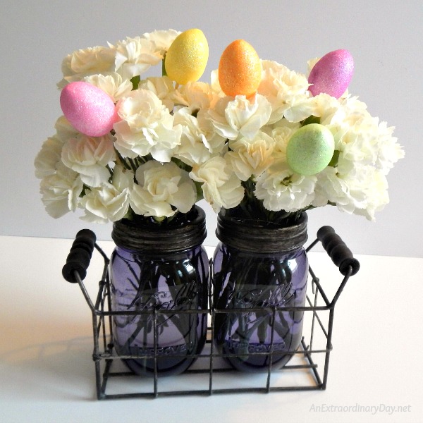 Amethyst Mason Jars filled with Mini Carnations and Egg on sticks 