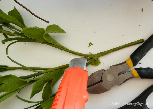Use a wallpaper cutter to cut apart the stems from floral bushes