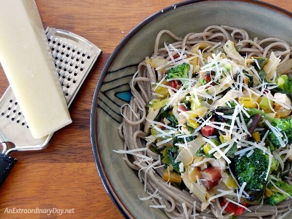 Pecorino Romano Cheese is the crowning touch to this delicious medley of sauteed veggies and noodles - AnExtraordinaryDay.net