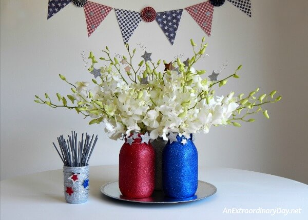 Create a Stunning Red, White, and Blue Centerpiece with Simple Mason Jars and Flowers that will Sparkle and Look Stunning for the Fourth with this Tutorial from AnExtraordinaryDay.net