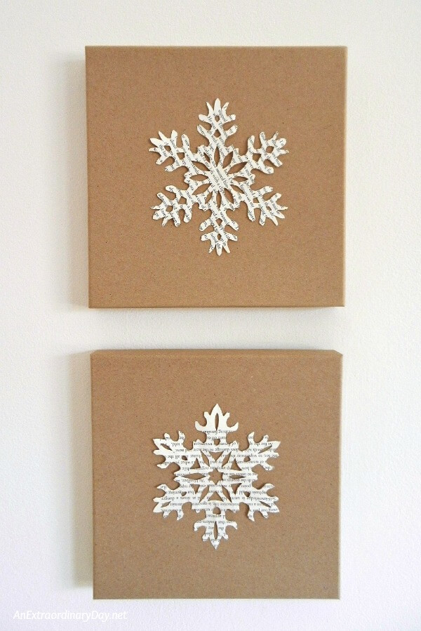 Hand cut book pages snowflakes become wintry wall art on these flat kraft gift boxes 