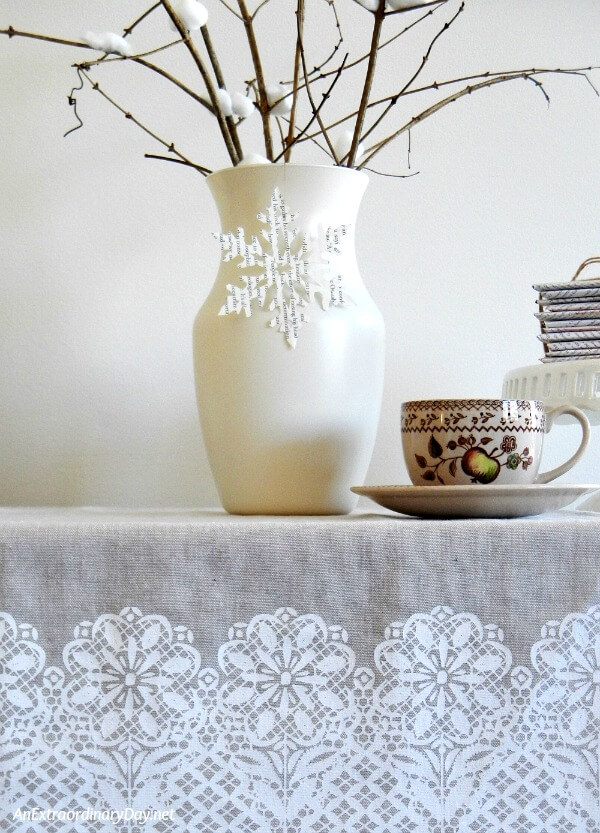 Tea towel picks up the hint of the hand cut snowflake design in this wintry vignette