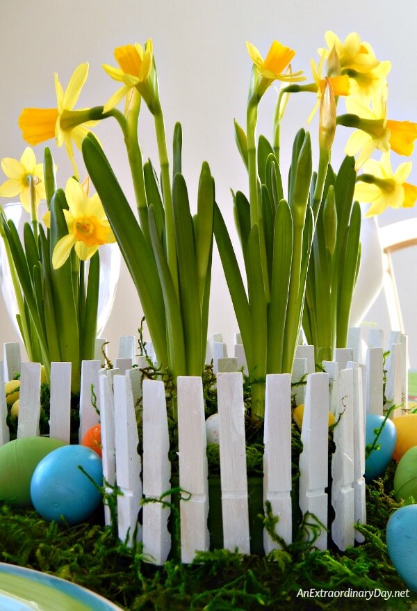 Clothespins become pickets for a fence in this easy and inexpensive Easter Centerpiece