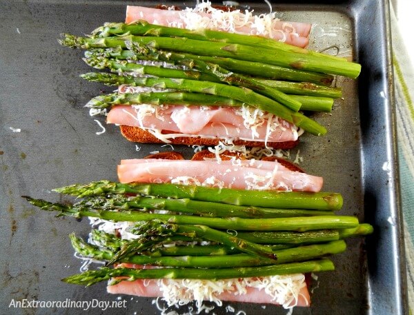 Layer cheese and then add asparagus to this open faced sammie 