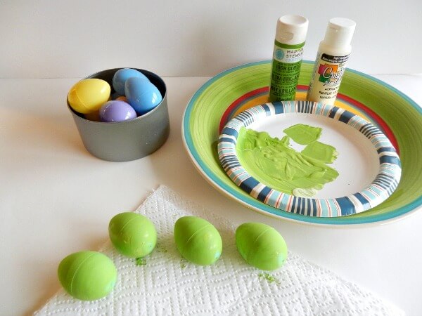 Paint cheap plastic eggs to match dish colors -