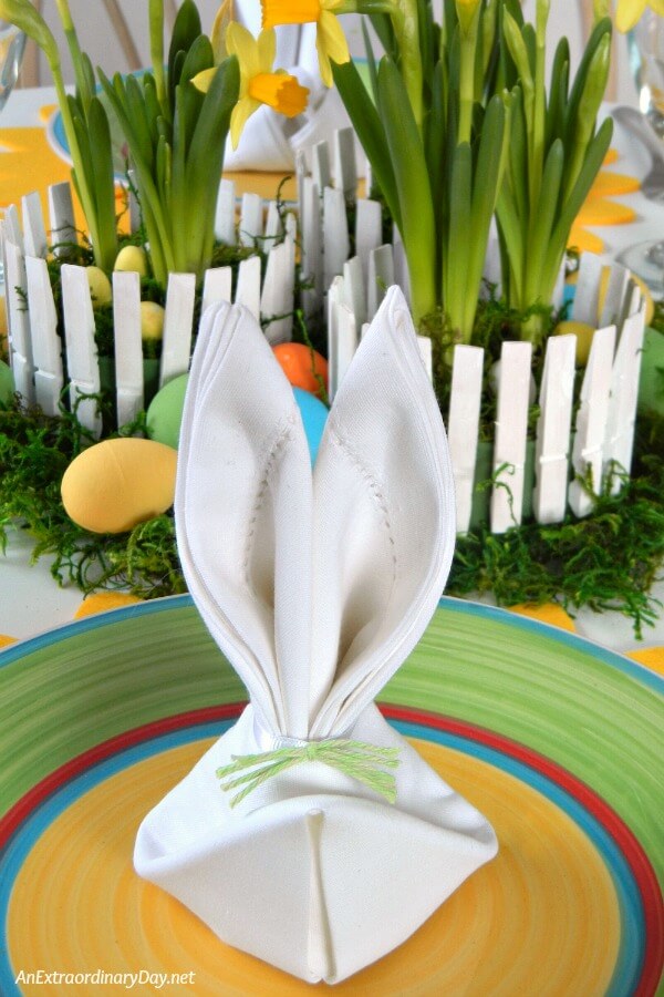 The crowning touch to the Easter table setting is a napkin folded rabbit