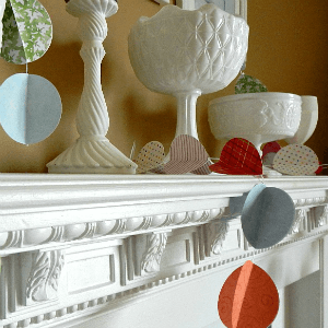 Simple Spring Mantel - Paper Garland and Milk Glass Dramatic White Mantel for Spring 