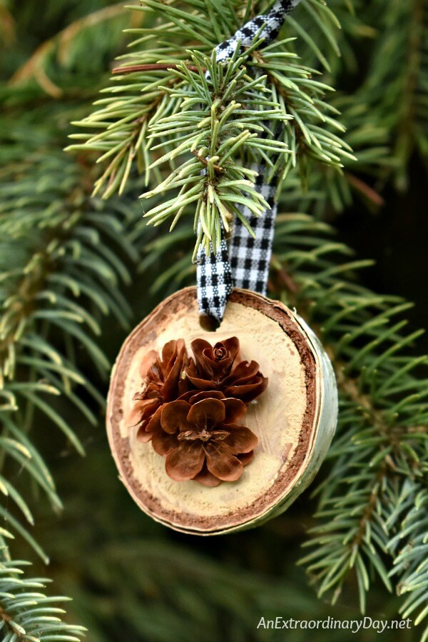 Learn to make these simple rustic birch and pine cone Christmas ornaments to decorate your tree. Great for gift-giving, too! 