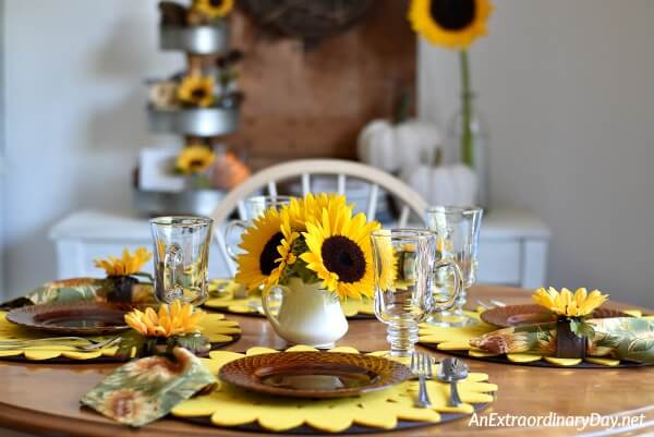 Set a sunny fall table with fresh sunflowers and faux sunflower napkin rings made with the tutorial here