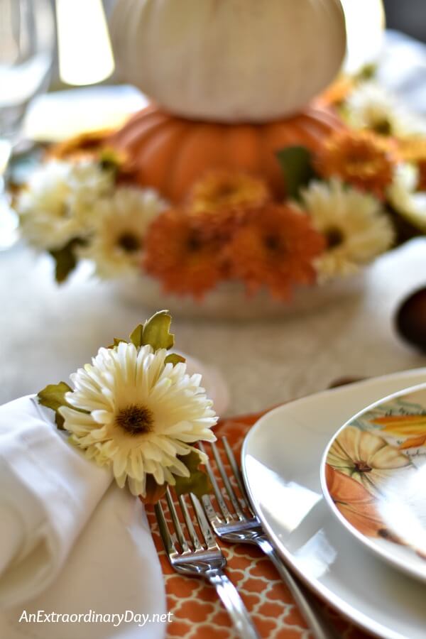 Learn how to create a simple elegant and budget friendly Thanksgiving table setting with a pumpkin theme with a bit of DIY and cheap table accessories
