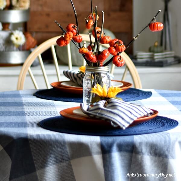 Simple fall table setting on blue and white check tablecloth 