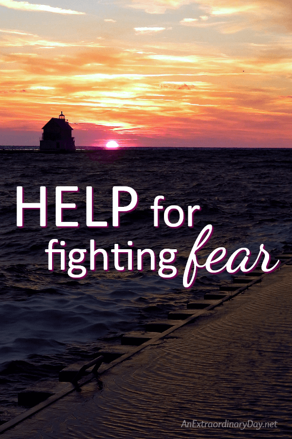 Help for fighting fear - Sunset with Lighthouse over Lake Michigan - Inspirational Devotional - AnExtraordinaryDay.net