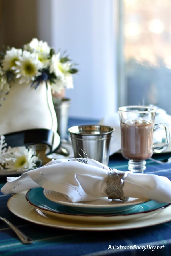Inexpensive dinnerware in turquoise and white make a lovely table setting for this Winter Olympics dinner table - AnExtraordinaryDay.net