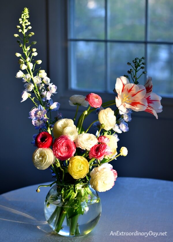 Brilliant vase of colorful ranunculus flowers - part of devotional on rest and trust - AnExtraordinaryDay.net