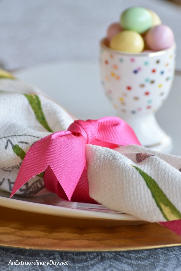 Bring pink ribbon tied to make napkin ring on this Easter table - AnExtraordinaryDay.net