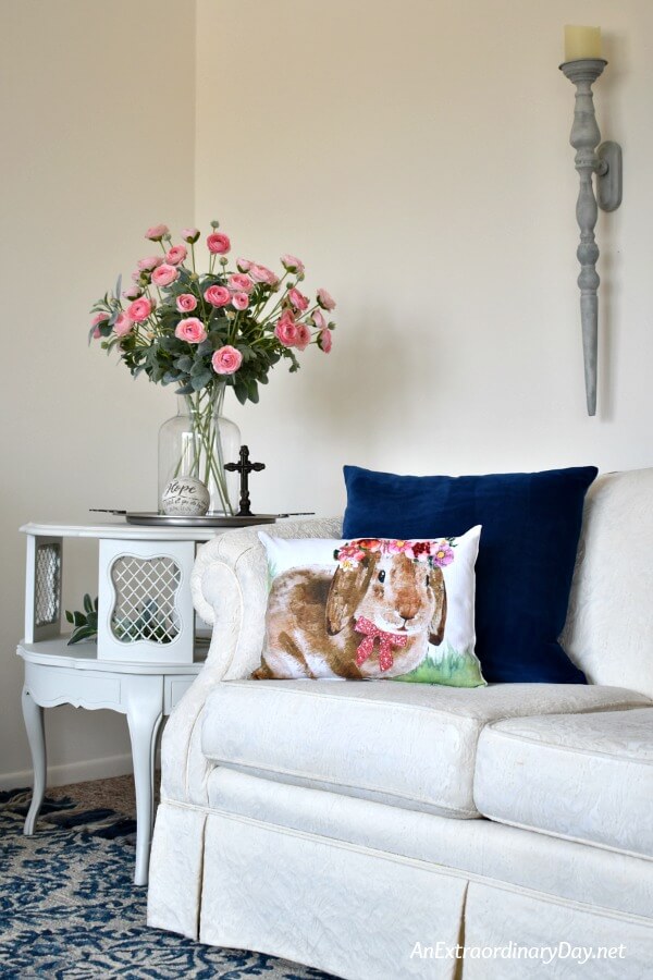 Creamy white living room with blue accents and pink ranunculus and a DIY Bunny Pillow - AnExtraoradinaryDay.net