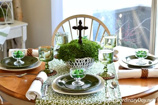 Moss and cross centerpiece on this green and white St. Patrick's Day tablesetting - AnExtraordinaryDay.net