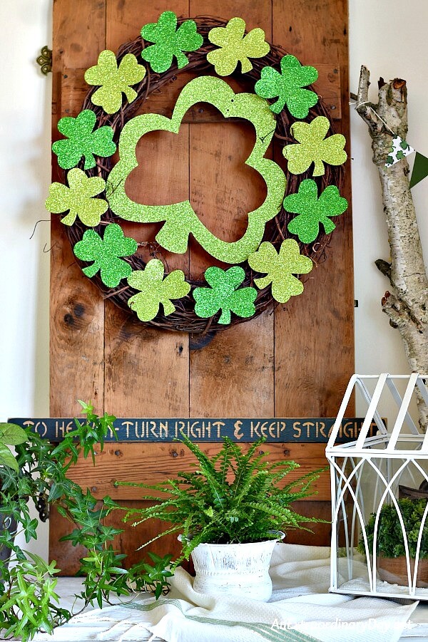 Simple & Sparkly St. Patrick's Day Wreath on Rustic Wooden Door on Console Table - AnExtraordinaryDay.net