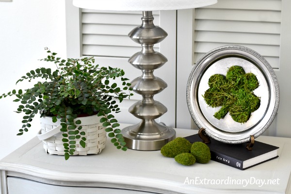 St. Patrick's Day home decor vignette in light gray, silver, and live green - AnExtraordinaryDay.net