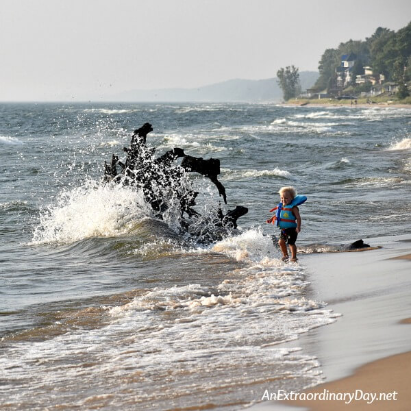 Wave splash and little boy on Lake Michigan - Encouragement for hard times and God's faithfulness - AnExtraordinaryDay.net