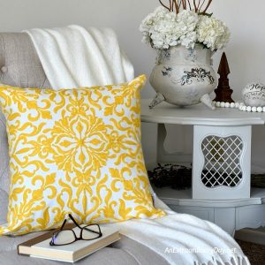 French Country Spring Vignette with Chair + Pillow + Sidetable + Faux Iron Urn - AnExtraordinaryDay.net